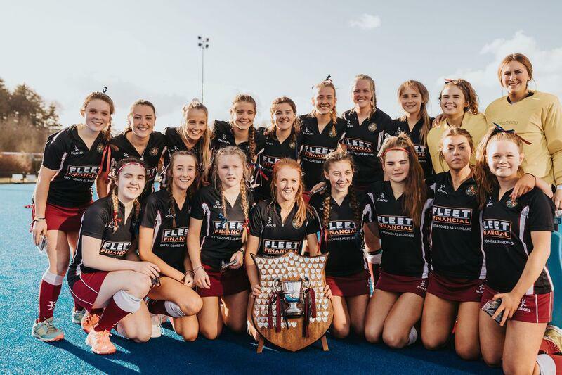 Team line up with trophy
